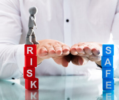 Person assisting human figure while moving from risk to safe